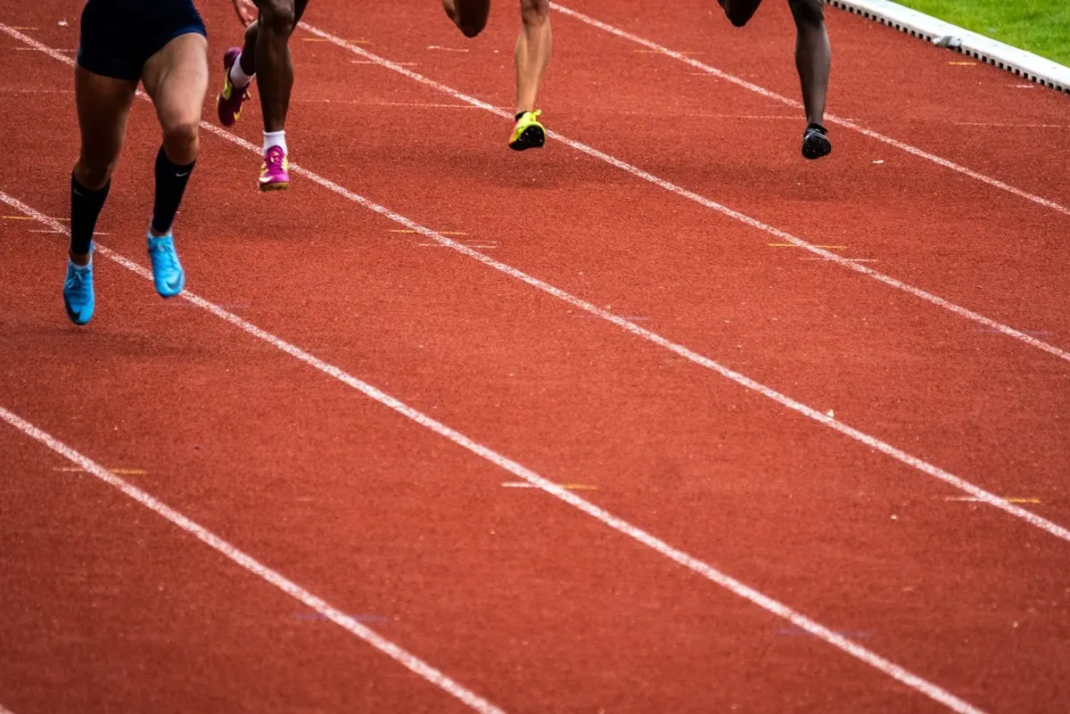 Runner training at a hard pace on an indoor track