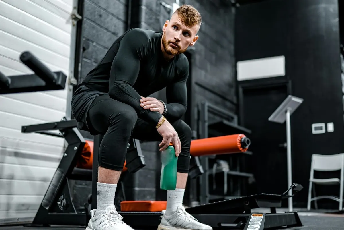 An athlete in workout gear on exercise equipment during a training session