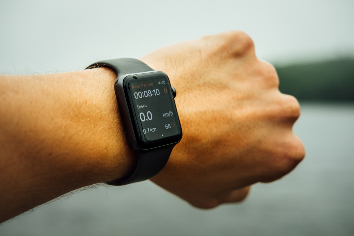 Apple Watch showing running workout data on a wrist