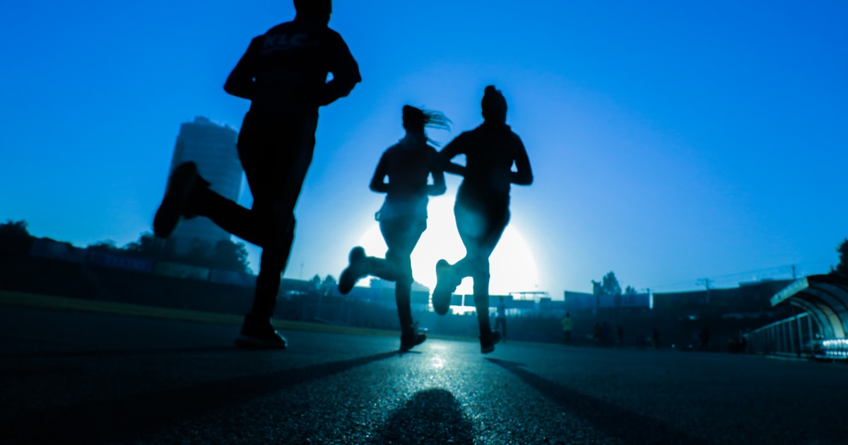 Runners training at sunrise