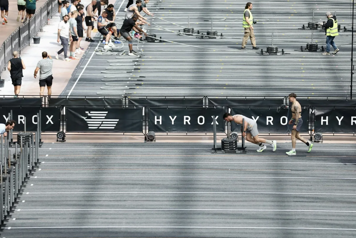 Athletes competing at a HYROX fitness race